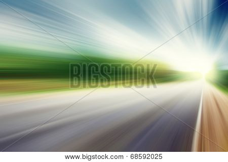 Image of asphalt road in motion blur at moody day. 