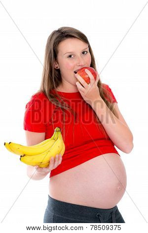 Young Pregnant Woman In Red Shirt Is Eating Fruits