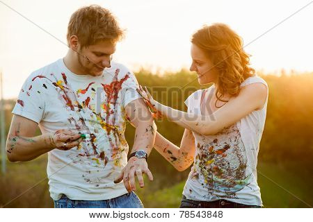 Couple Paint On Each Other