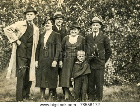 GERMANY, CIRCA 1930s- vintage photo of family in garden