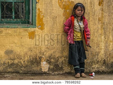 Hmong Schoolgirl Standing Against Yellow Wall.