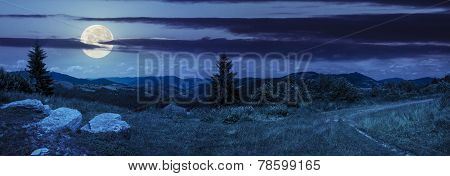 Boulders On Hillside Meadow In Mountain At Night