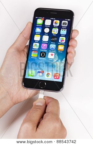 Plugging lightning cable into an iPhone