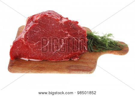 fresh raw red beef meat big steak chunk on wooden cut board isolated over white background