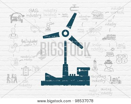 Manufacuring concept: Windmill on wall background