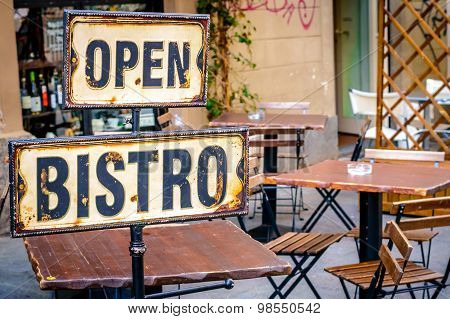 Open Bistro Sign At The Empty Caffe Terrace