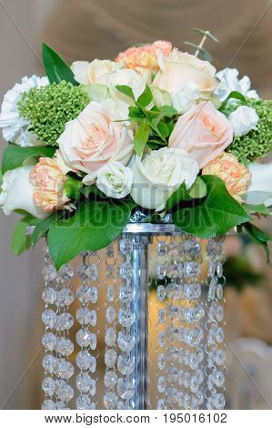 Bouquet with delicate flowers on base. Wedding flowers for the bride.
