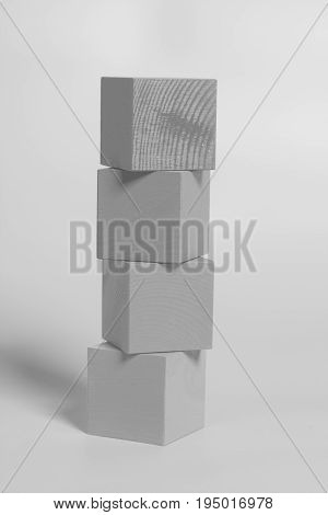 Wooden cubes on a gray background .