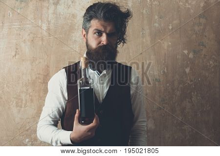 Man Holding Bottle Of Wine