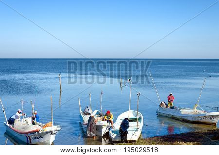 CAMPECHE MEXICO FEBRUARY 24: Group of fishermen on the shore close to Champoton Mexico on February 24 2017