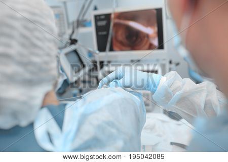 Doctors focused on the process of medical procedure.