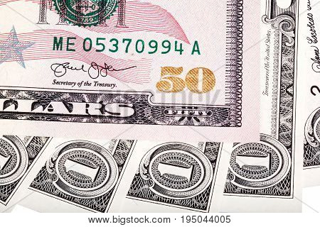 Photo of fifty U.S. dollar bill, abstract background
