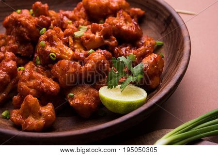 Gobi Manchurian dry - Popular street food of India made of cauliflower florets, selective focus