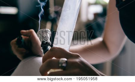 .smoking Marijuana With A Bong Close-up . Legalization And Dependence On Light Drugs