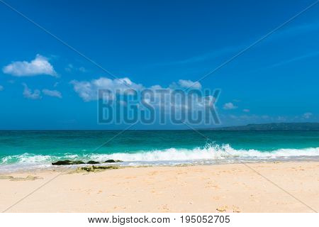 BORACAY WESTERN VISAYAS PHILIPPINES - JANUARY 14 2015: Waves white sand and a beautiful water composes the Puka Beach located in the north of Boracay's Island.