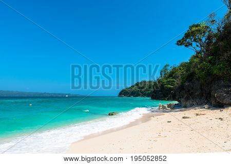 BORACAY WESTERN VISAYAS PHILIPPINES - JANUARY 14 2015: Wide angle view of the tropical Puka Beach located in the north of the island of Boracay.