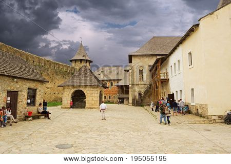 Khotyn Ukraine - 21 May 2017: Tourists walking inside of the Khotyn castle in Ukraine.