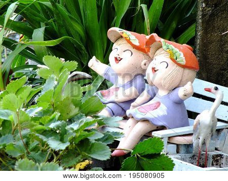 Clay Dolls Children Boy And Girl Smiling And Laughing Garden Decorete