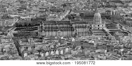 Aerial view of Paris from above with a Sacre Coeur on the horizon. .Black and white photo