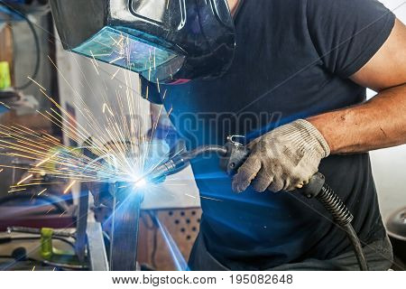 Man Weld A Metal Welding Machine