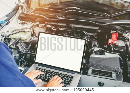 Professional Car Mechanic Working In Auto Repair Service Using Laptop Bon Car