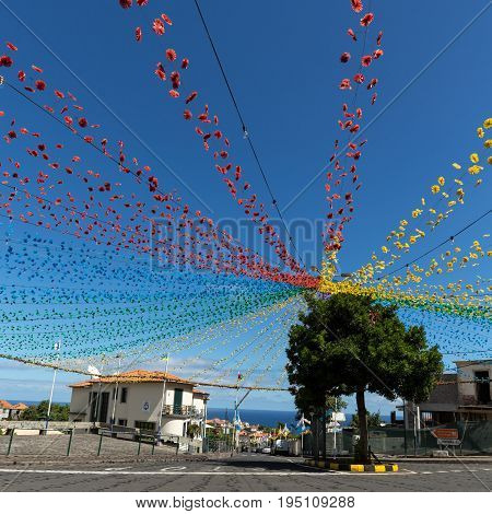 PONTA DELGADA PORTUGAL - SEPTEMBER 10 2016: Garlands street decorations at Madeira Wine Festival in Ponta Delgada Madeira Portugal. The Madeira Wine Festival honors the grape harvest with a celebration of traditional local heritage and wine production.