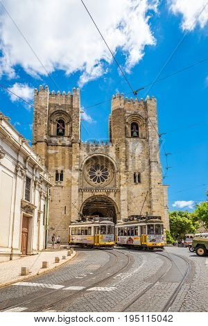 LISBON,PORTUGAL - MAY 18,2017 - View at the Cathedral of St.Mary Major with old trams in the streets of Lisbon. Lisbon is the capital of Portugal.