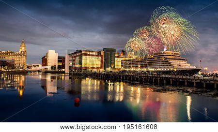 Liverpool: JULY 11th 2017 - Fireworks erupt over the Cunard cruise liner Queen Elizabeth in Liverpool