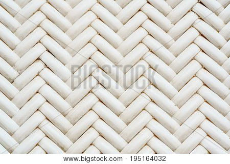 Close up synthetic white rattan weaving the seat of a chair