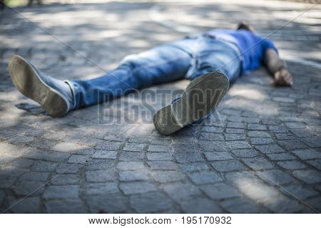 unconscious guy after heart attack in the outdoor