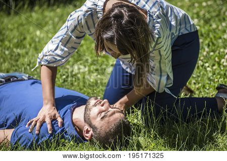 girl trying to find help for an unconscious guy