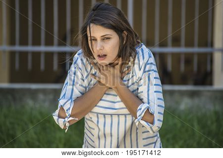 girl searching help while she's choking during feeding