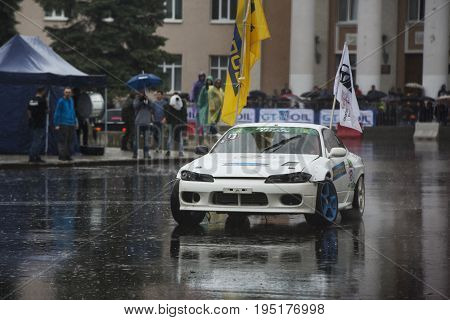 Russia, the city of Novokuibyshevsk, June 24, 2017, Technopark-2017 festival, rain and cars.