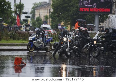 Russia, the city of Novokuibyshevsk, June 24, 2017, Technopark-2017 festival, rain and cars.
