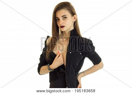 beautiful young brunette take off her black jacket isolated on white background