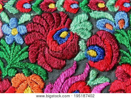 Multicolor Floral Hand Embroidery Pattern Closeup Background