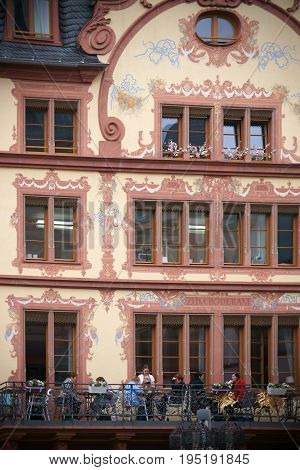 MAINZ, GERMANY - APRIL 20: The listed facade of the historic building and cafe Zum Boderam painted with ornaments on the Gutenberg Square on April 20, 2017 in Mainz.