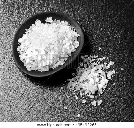 the white salt on black fod  background