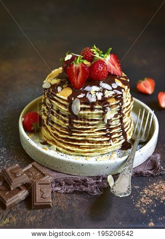 Homemade Pancakes With Fresh Strawberry,chocolate And Almond Petals.