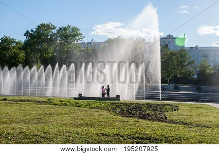Yekaterinburg, Russia - May 31, 2017: Two Women Near The Bench On The Embankment Of Iset River On Th
