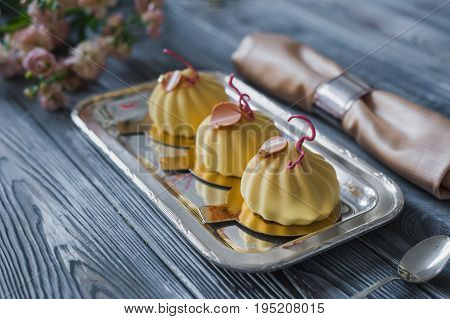 Zephyr Marshmallow flavored with lemon are on metal plate. Close up of healthy airy dessert