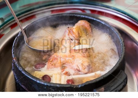 tibetan delicious food in stone pot to boil chicken with some wild mushroom