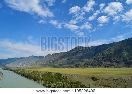 Landscape of Katun river and hills of Altai mountains. Altay Republic Siberia Russia.