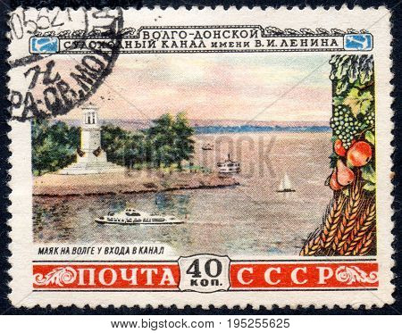 UKRAINE - CIRCA 2017: A postage stamp printed in USSR shows Volga lighthouse at the gate of the Canal from the series Volga-Don navigable canal named after V.I. Lenin circa 1953