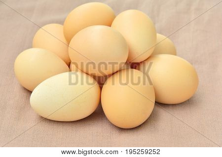 Close up stacked egg  On brown sack background.