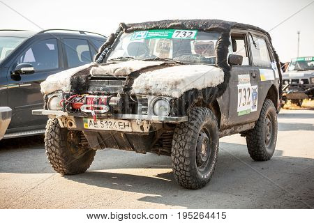 KIRILLOVKA UKRAINE - MAY 25 2016: Zaporizhia Trophy 2016. II stage of offroad trophy Ukrainian championship. Legendary soviet car vaz Niva decorated with fur.