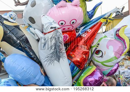 Agno, Switzerland - 12 March 2016: Colorful inflated balloons selling at a market