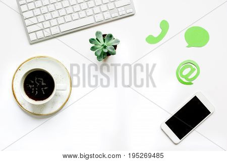 customer support service desktop with email signs on white office background top view mock-up