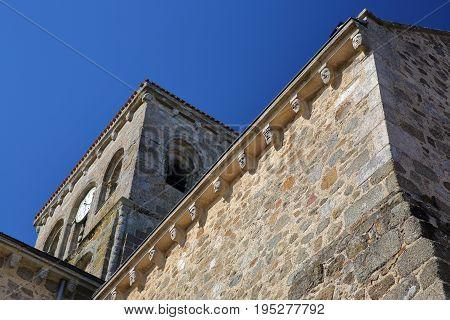 Details of the carved modillions at the top of St Jacques Church in Pouzauges, Vendee, France