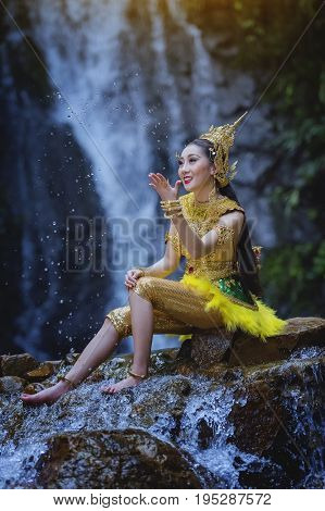 Beautiful girl in Thai traditional costume.Thai traditional uniform dresswoman wearing typical thai dressidentity culture of ThailandHappy rural girl smilingLady in Thai literature Kinnaree
